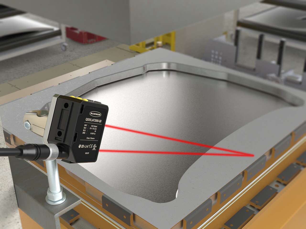 q5x-metal-stamping-machine laser sensor verifies that a metal sheet is indexed on a stamping press