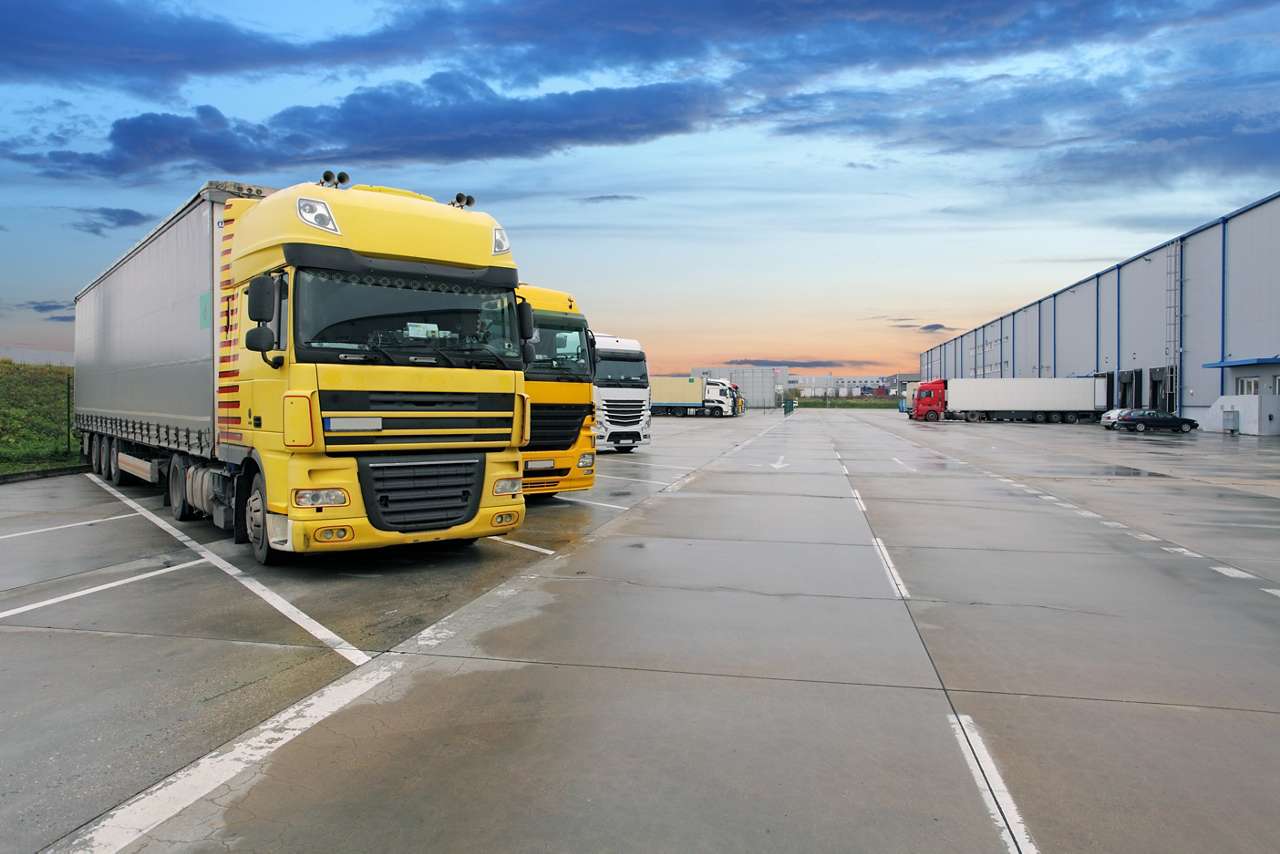 Cargo truck at warehouse building