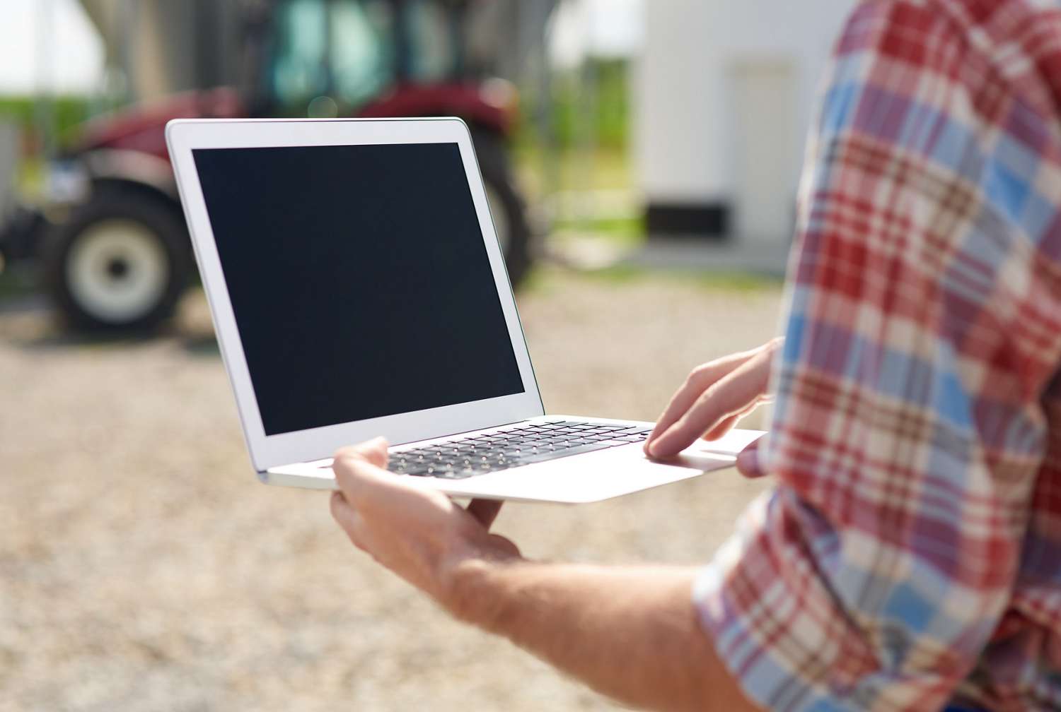 Closeup of laptop being used on a farm